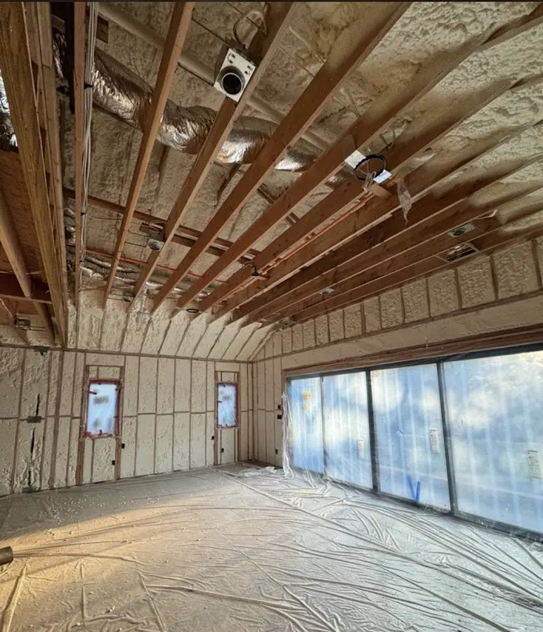 Interior walls and ceiling insulated with spray foam during new construction in South Monrovia Island